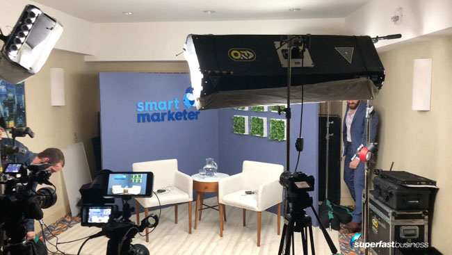 A photo of Ezra on the Smart Marketer set at T&C in San Diego